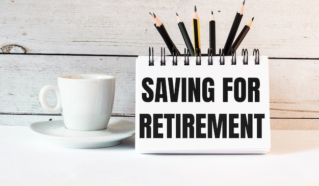 Notepad reading Saving for Retirement beside pencils and a coffee cup, outlining retirement plan options for self-employed professionals