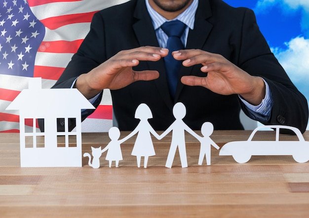 Suited person with paper cutouts of a family, house, and car with a U.S. flag, illustrating how to appeal a Social Security decision