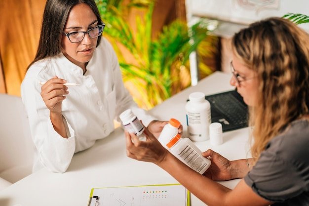 Healthcare provider and patient reviewing medication labels, navigating Medicare supplement plan options together